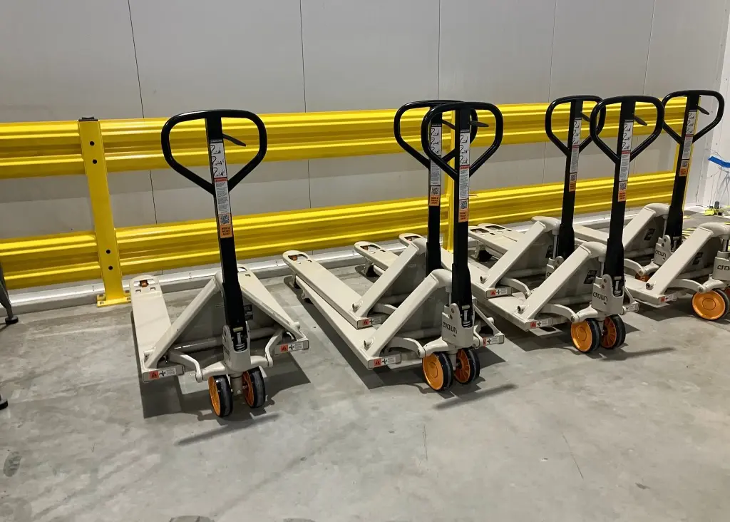 indoor yellow bolt down 2 rail 42" tall guard rail in warehouse