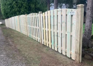 arched wood shadowbox privacy fence with contemporary posts